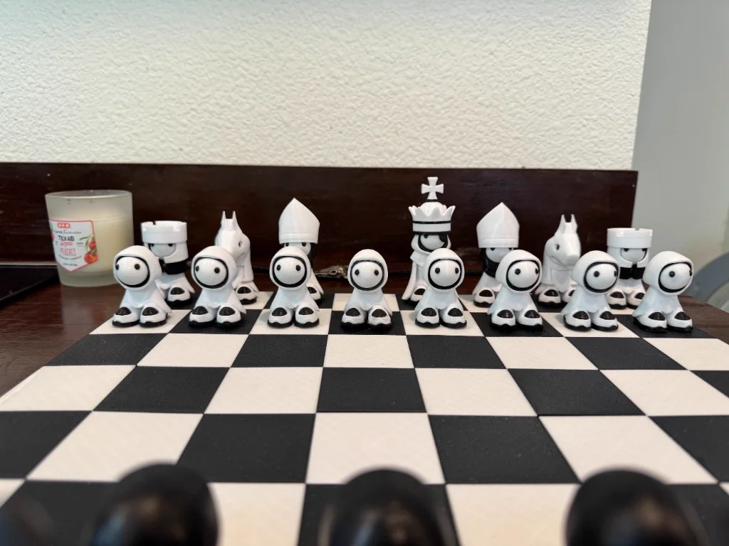 Custom 3D-printed character chess set on board